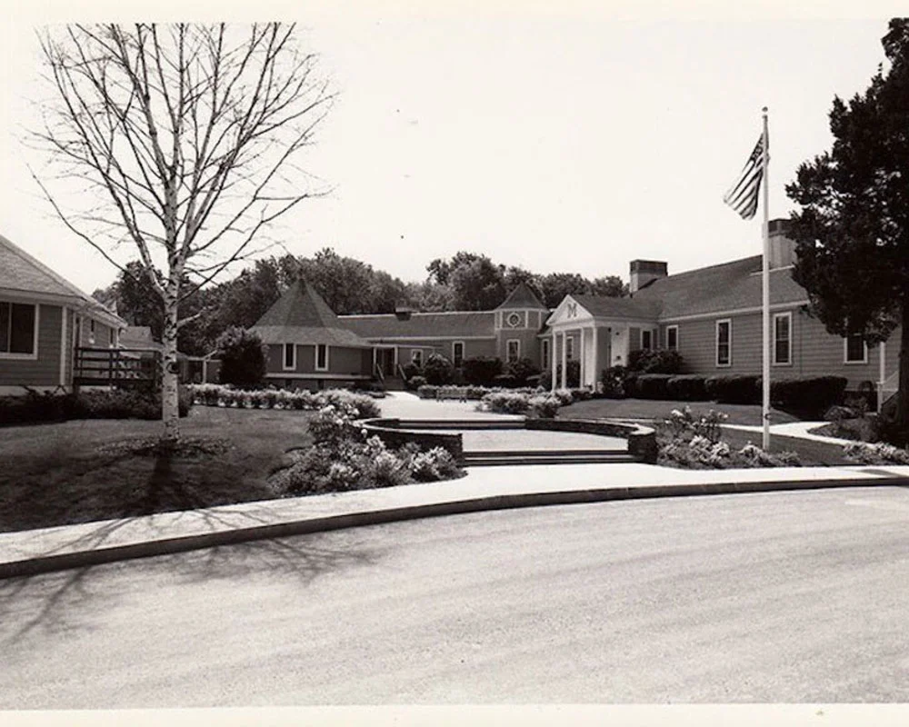 old photo of Meadowbrook building, road, and walkway