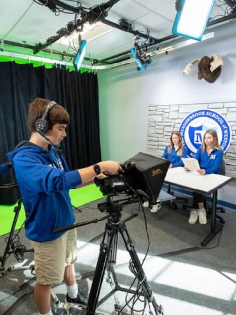 student using video camera equipment